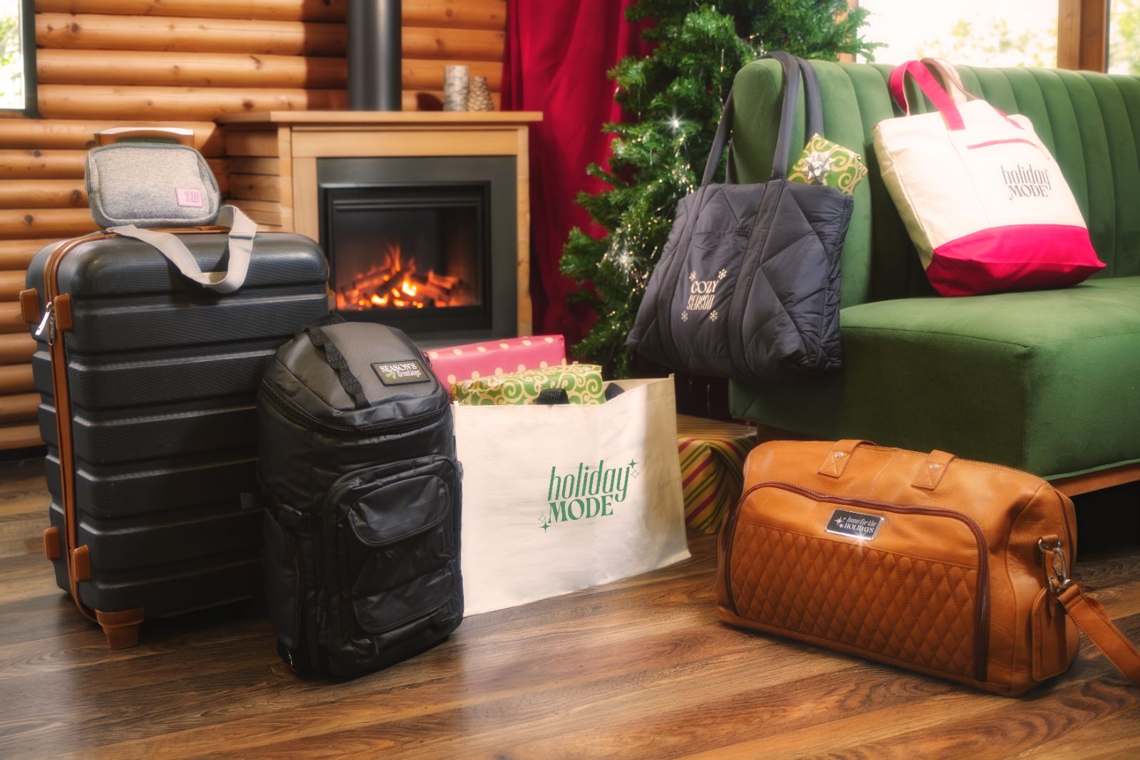 Branded totes, backpack and duffel by a fireplace